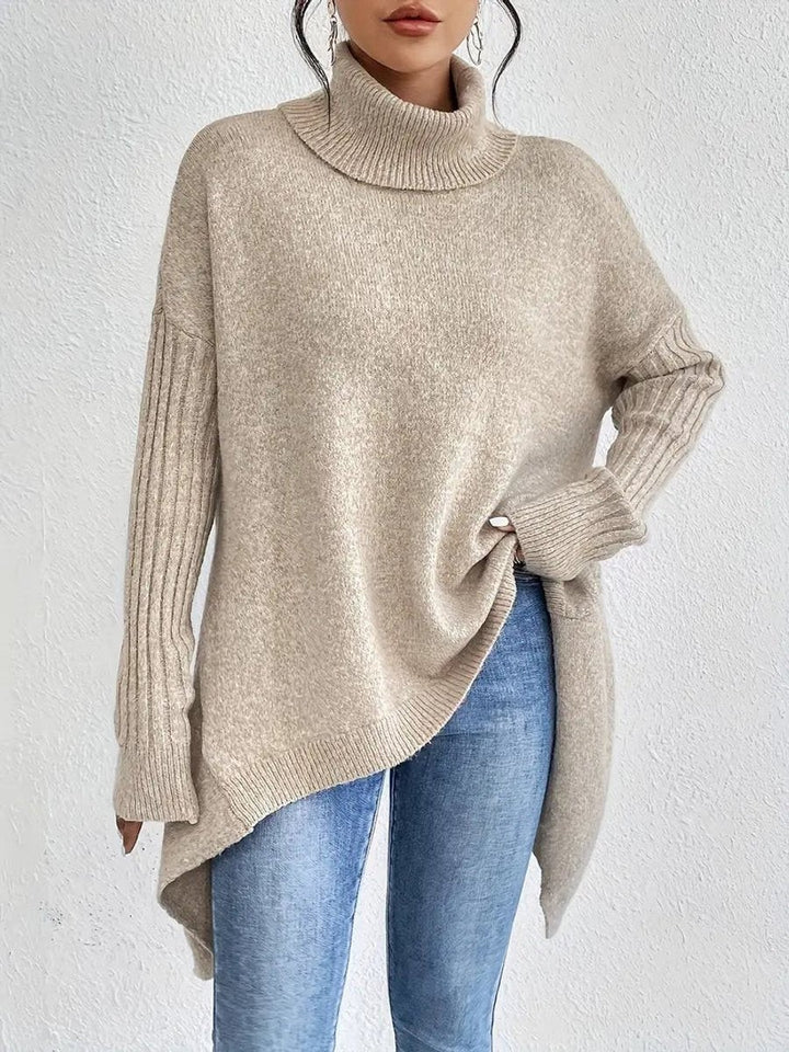 Beige ribbed-sleeve turtleneck sweater with flowy high-low hem, front view