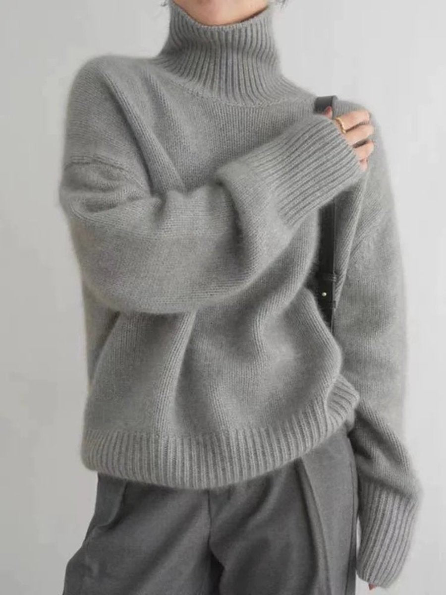 Heather gray oversized turtleneck sweater with ribbed knit trim and long sleeves
