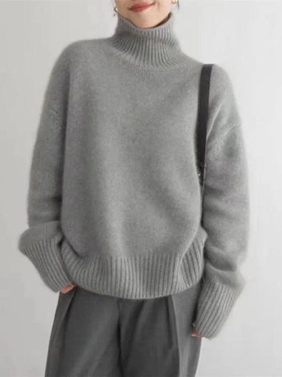 Gray cashmere-style turtleneck sweater styled with matching wide-leg trousers