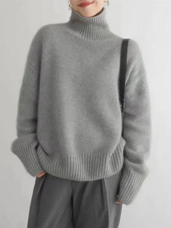 Gray cashmere-style turtleneck sweater styled with matching wide-leg trousers