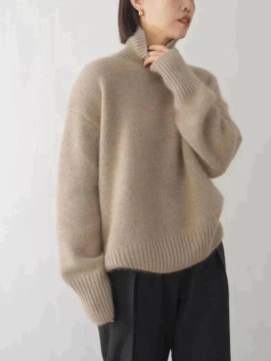 Taupe oversized turtleneck sweater with ribbed collar and relaxed knit sleeves