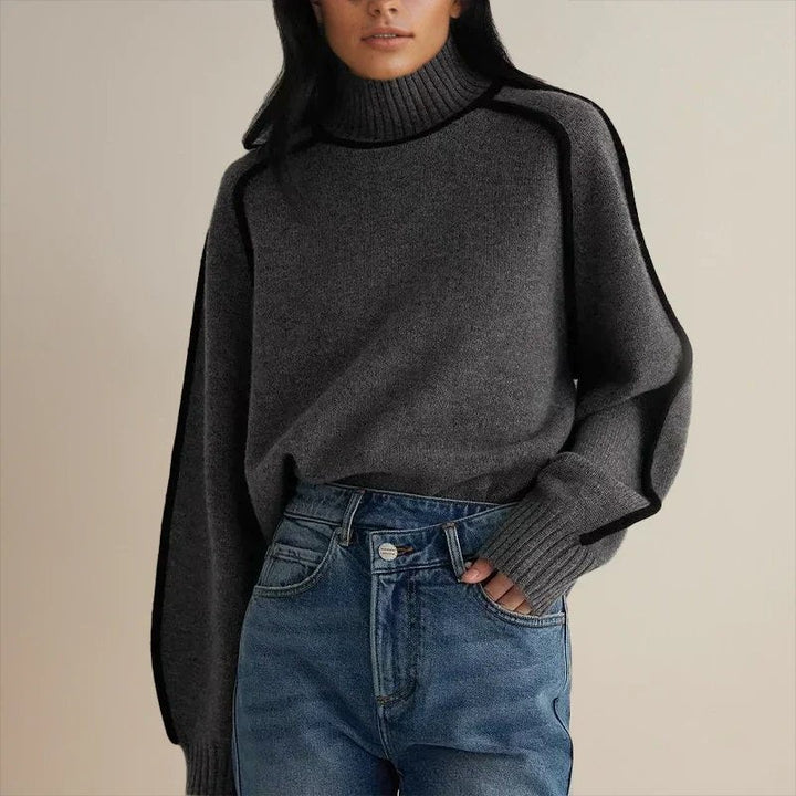charcoal gray oversized turtleneck sweater with contrast black piping detail