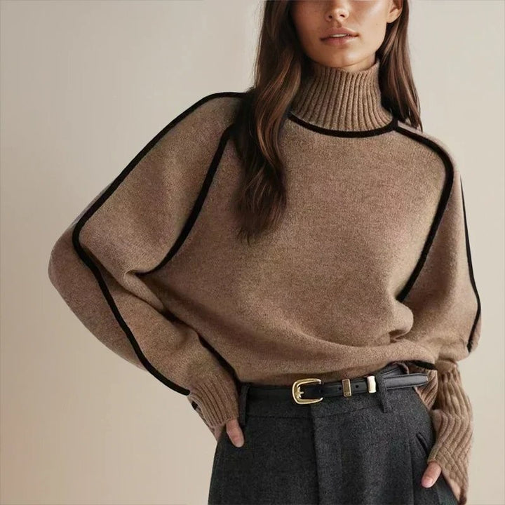 camel oversized turtleneck sweater with black contrast trim and belt