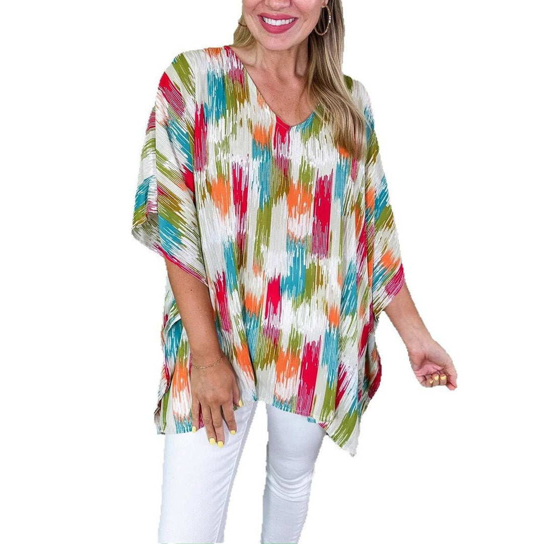 Multicolor abstract print kaftan top paired with white denim jeans