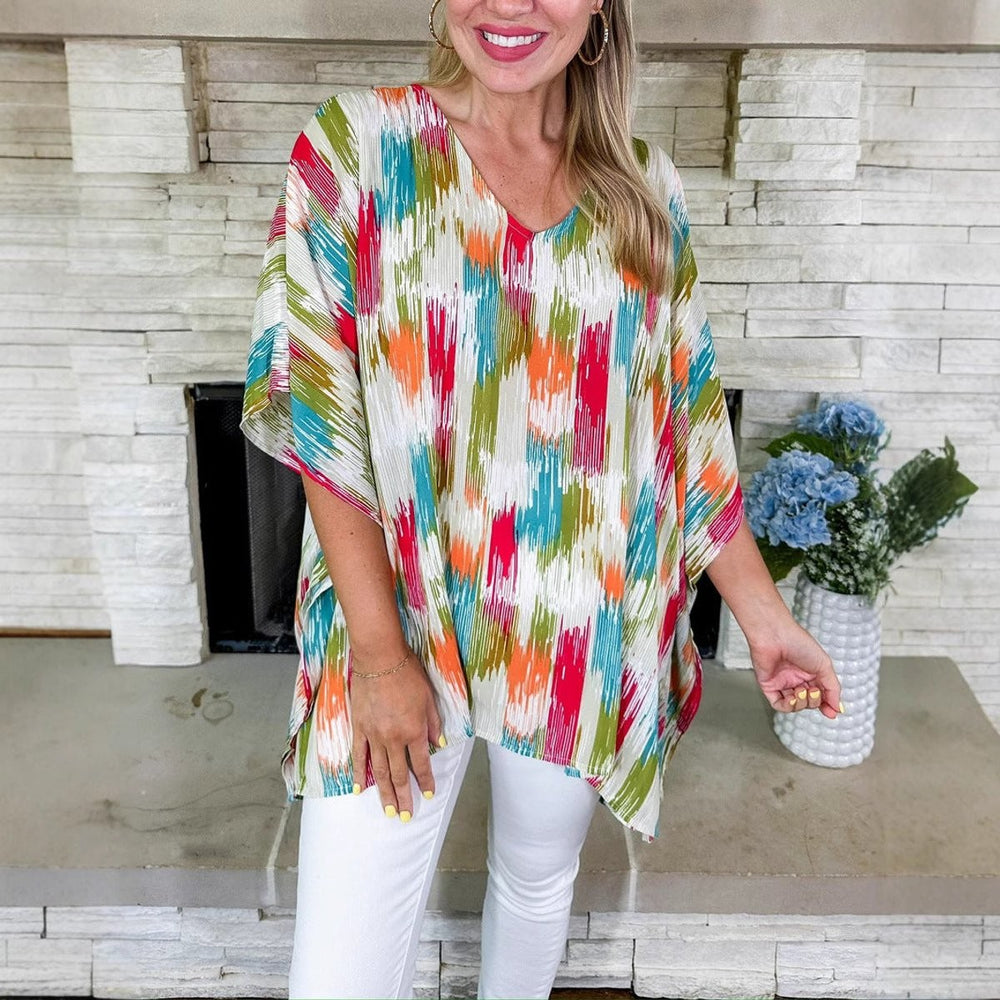 close-up of multicolor abstract print V-neck tunic top, oversized fit