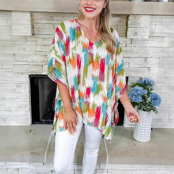 flowy V-neck tunic top featuring colorful abstract brushstroke print