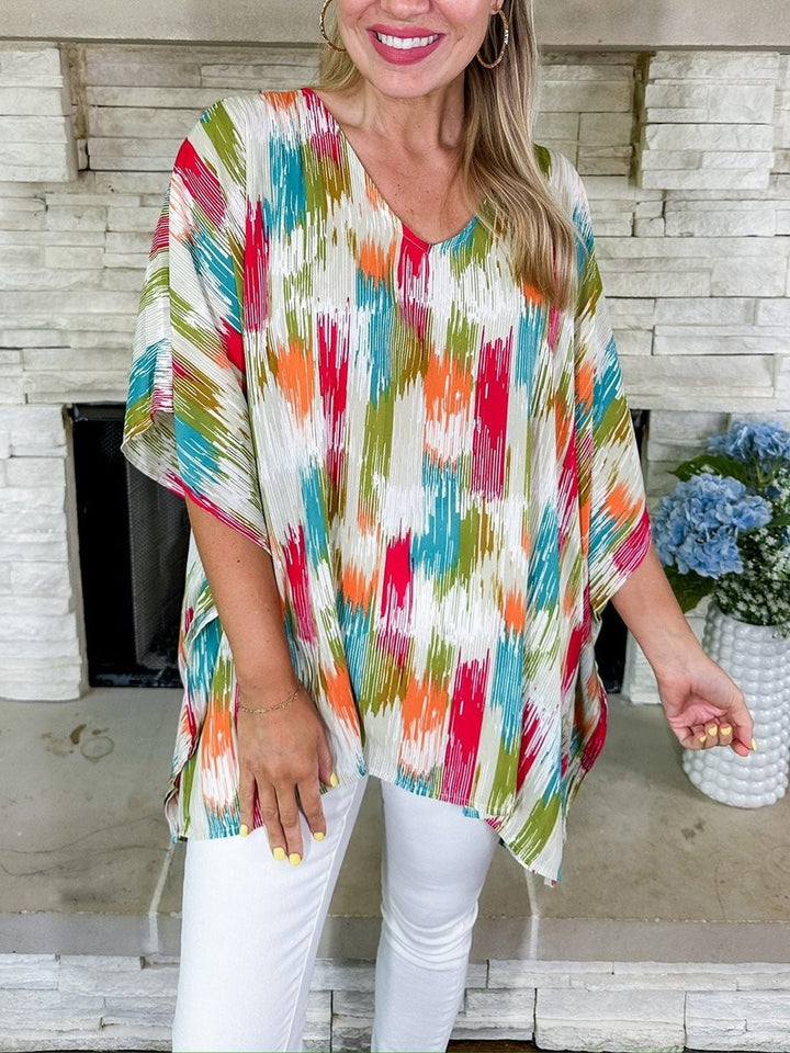 multicolor V-neck tunic top with relaxed silhouette and abstract pattern
