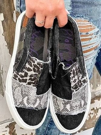 black canvas slip-ons featuring leopard and snakeskin print patchwork