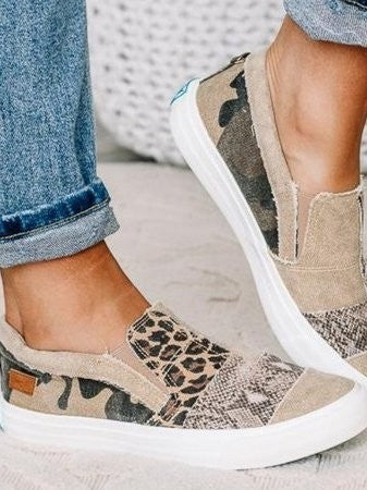 beige canvas slip-ons with leopard print and frayed edge detailing