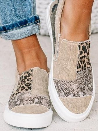 tan patchwork sneakers with snakeskin and leopard print panels closeup