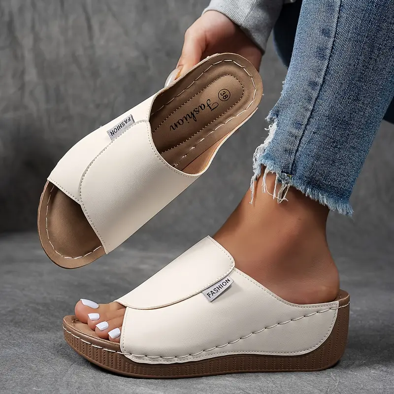 cream wedge sandal with open toe and stitched leather-look strap