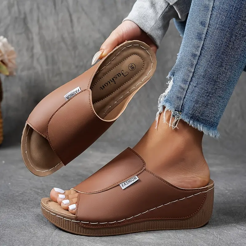 brown wedge slide sandal featuring contrast stitching and open toe design
