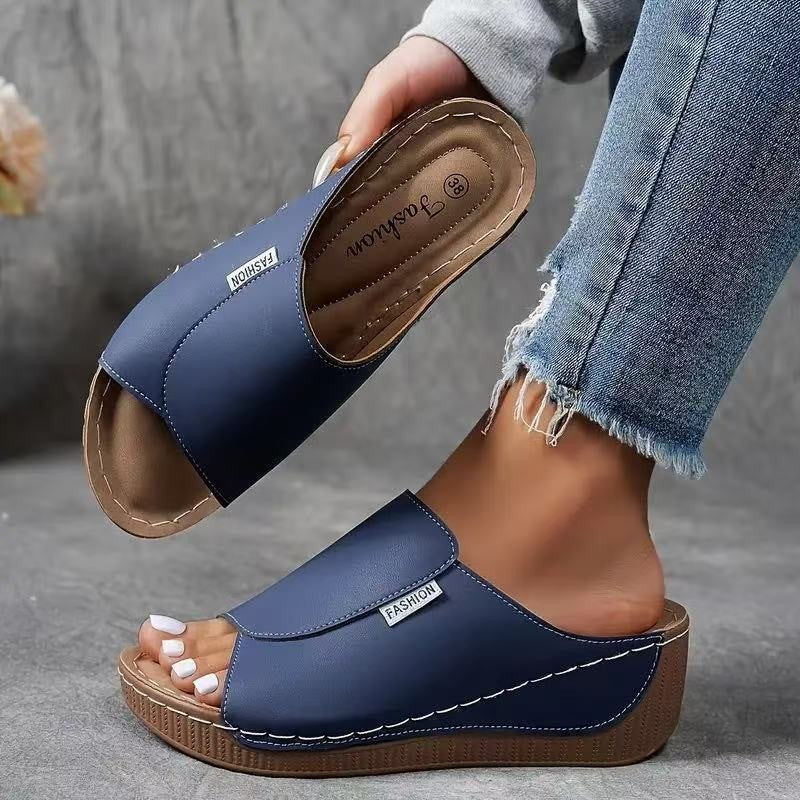 navy blue open-toe wedge sandal with stitched platform detail