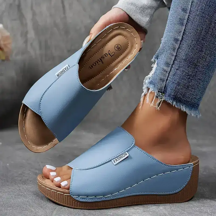 sky blue wedge sandal showing cushioned insole and open toe strap