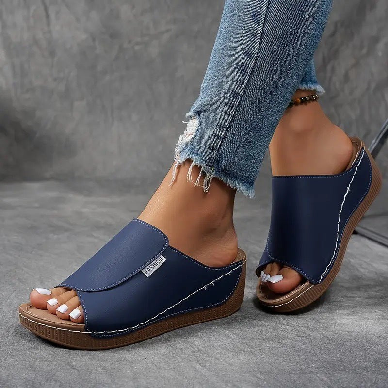 navy wedge sandal with crisscross strap and stacked platform sole