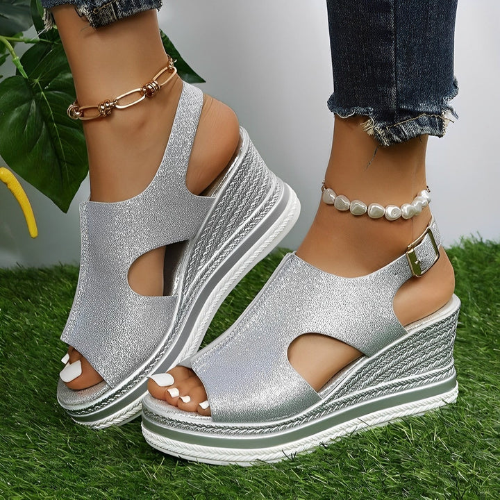 Silver glitter peep-toe wedge sandals with cutout ankle strap design