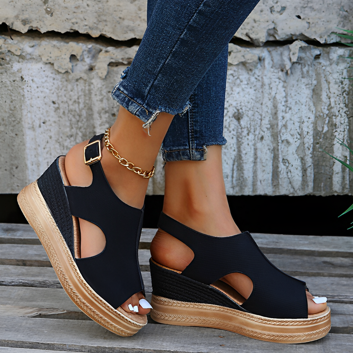 Black peep-toe wedge sandals with woven platform and side cutout detail