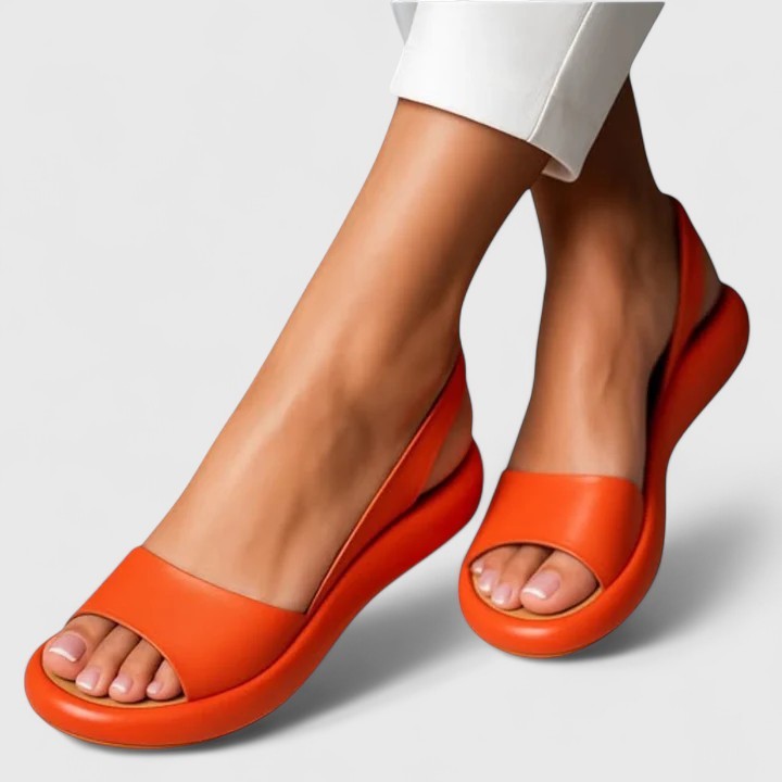 Orange platform slingback sandals featuring open toe and cushioned sole