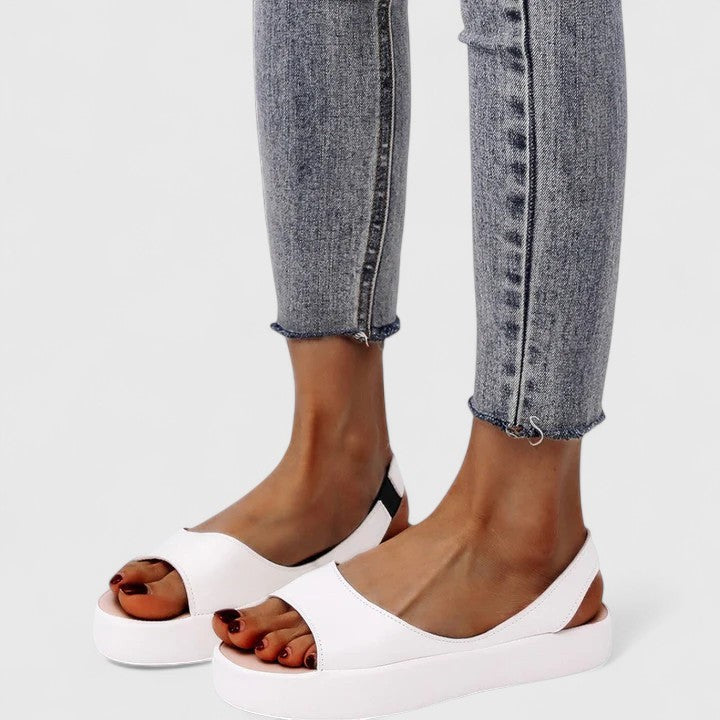 White peep-toe platform sandals featuring slingback strap and gray denim