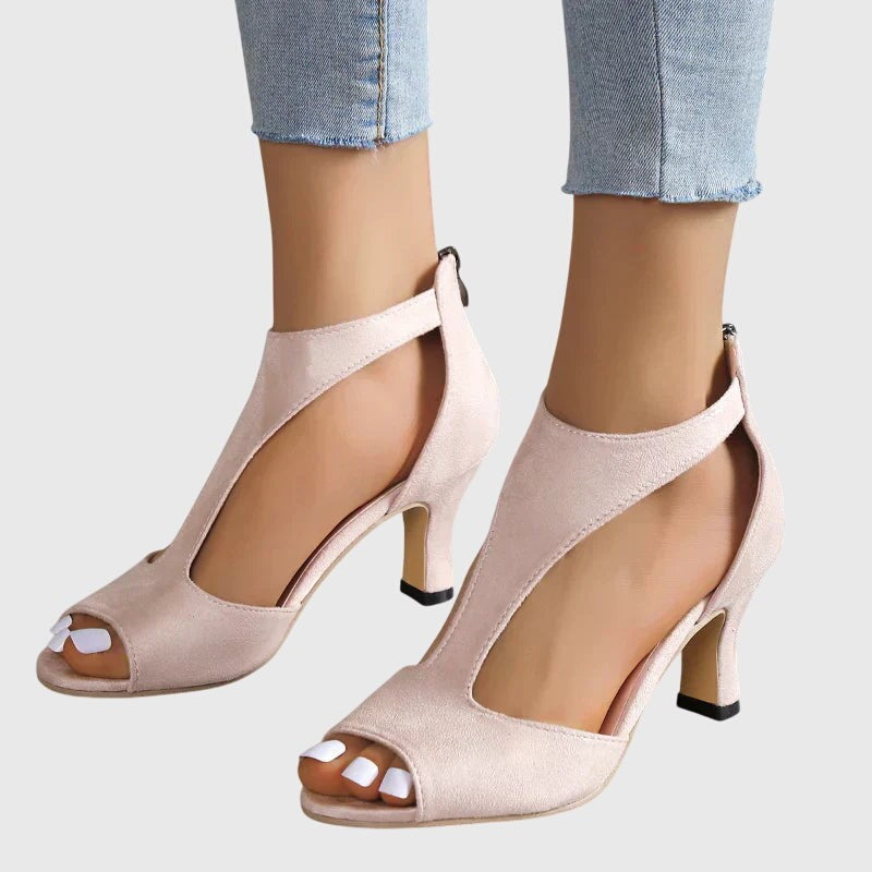 Nude peep-toe heeled sandals showing kitten heel and ankle cutout style
