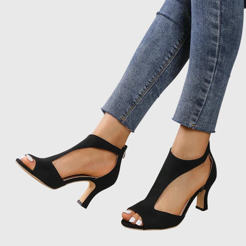 Black open-toe sandals with ankle strap and slender kitten heel