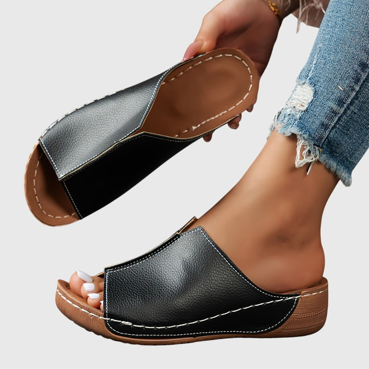 Black wedge sandal with peep toe and orthopedic sole design