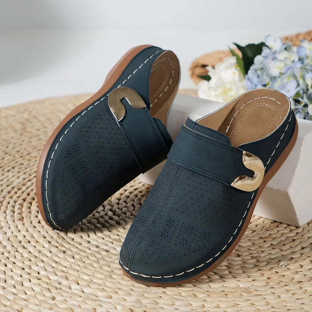 navy blue perforated wedge clog with gold buckle trim