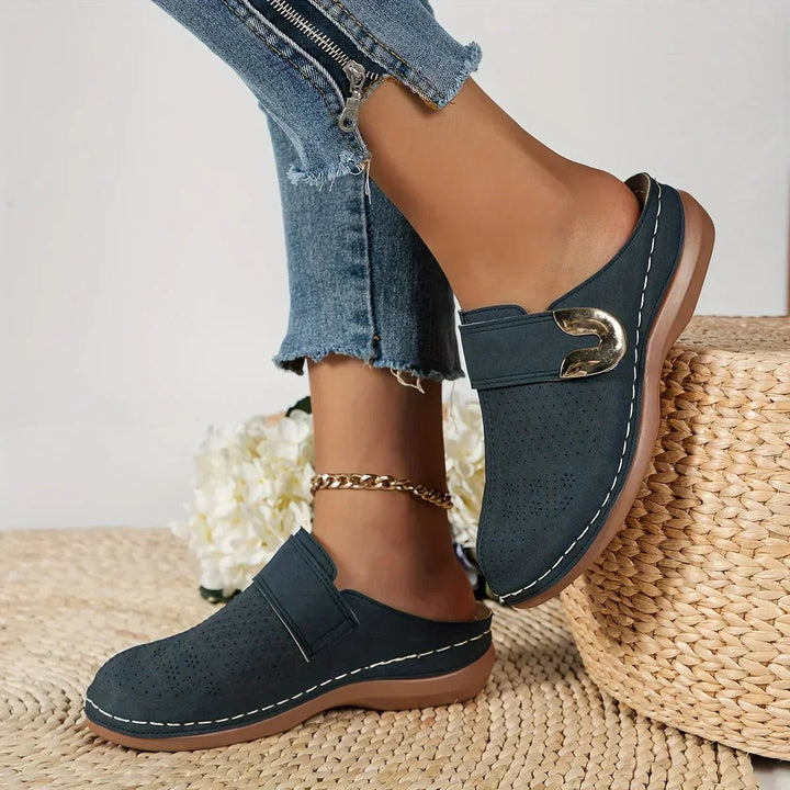 navy wedge clog with adjustable strap and contrast topstitching