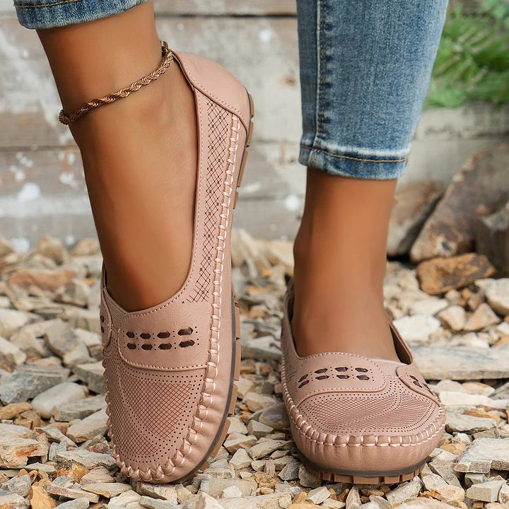 blush pink loafers with perforated pattern and hand-stitched trim detail