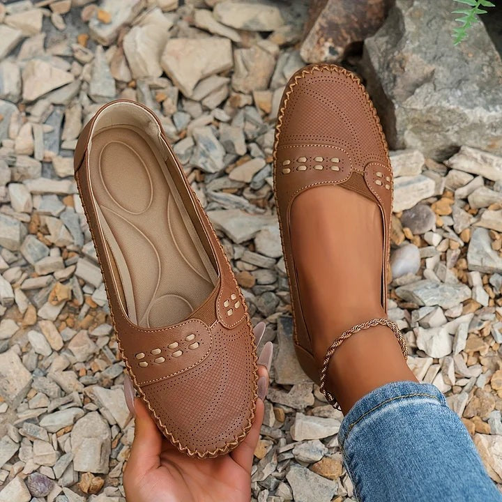 brown leather slip-on loafers with laser-cut detailing and contrast stitching