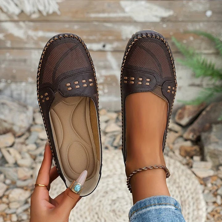 dark brown perforated loafers with woven texture and hand-stitched edges