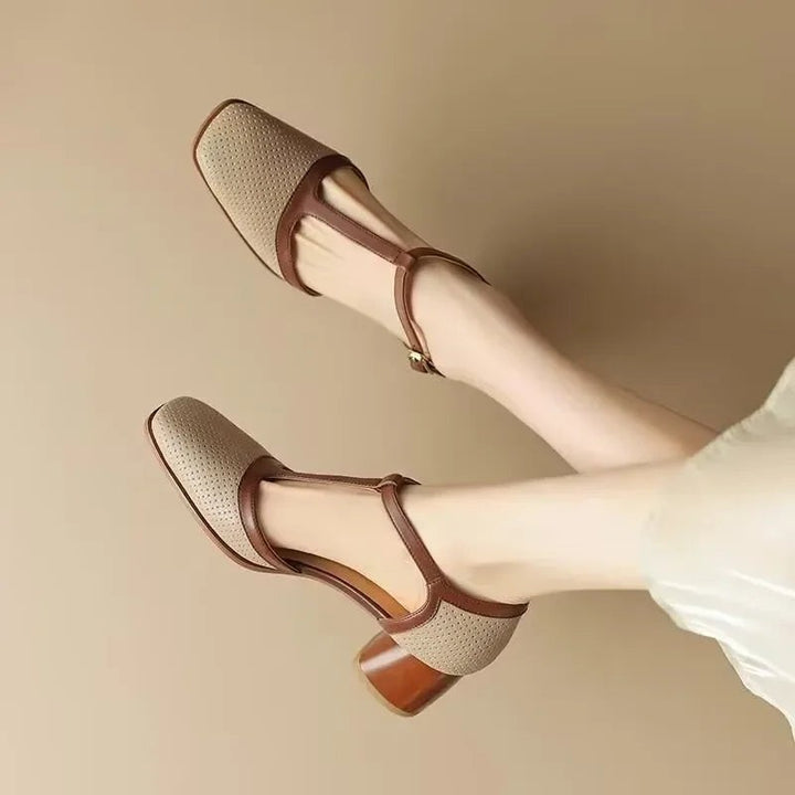pair of beige T-strap pumps with brown leather trim and block heel