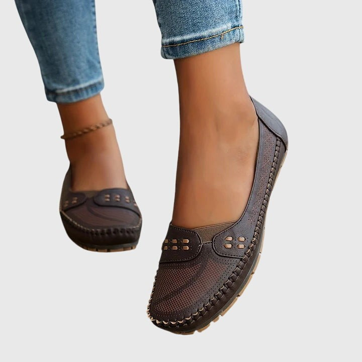 Espresso brown leather slip-ons with stitched trim, side view