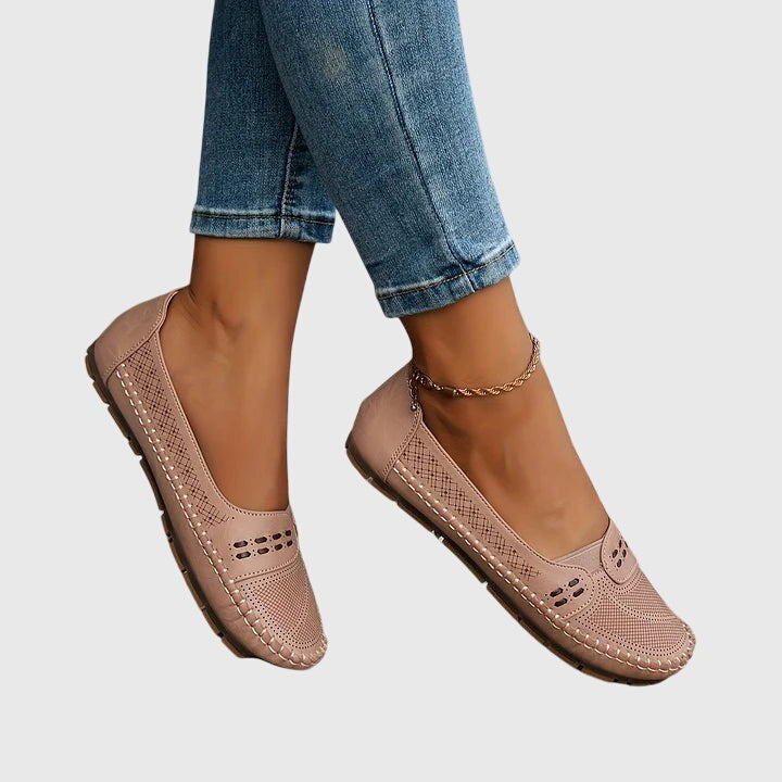 Dusty pink leather orthopedic flats worn on foot with anklet