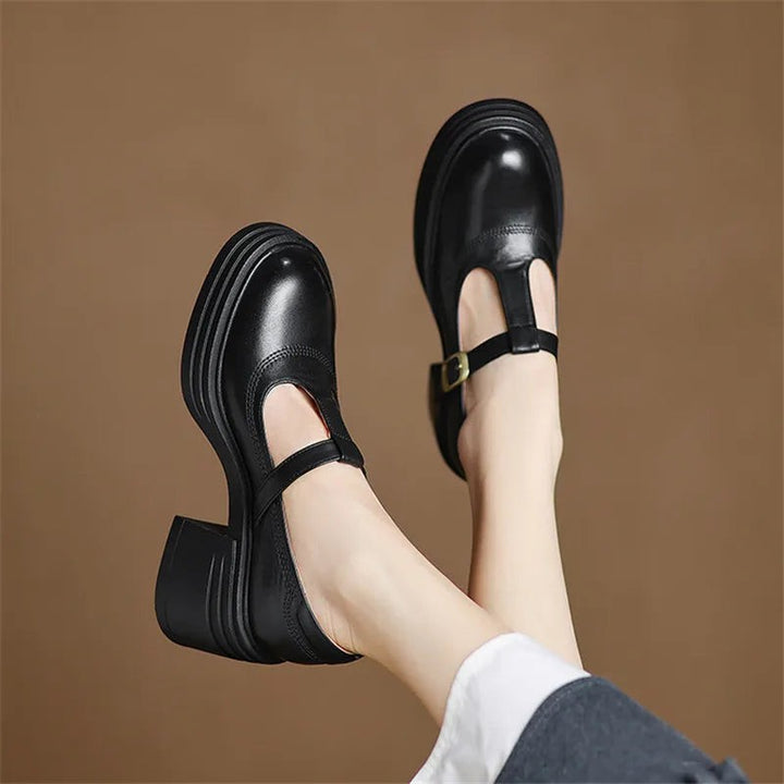 black leather Mary Jane pumps with T-strap buckle and chunky platform sole