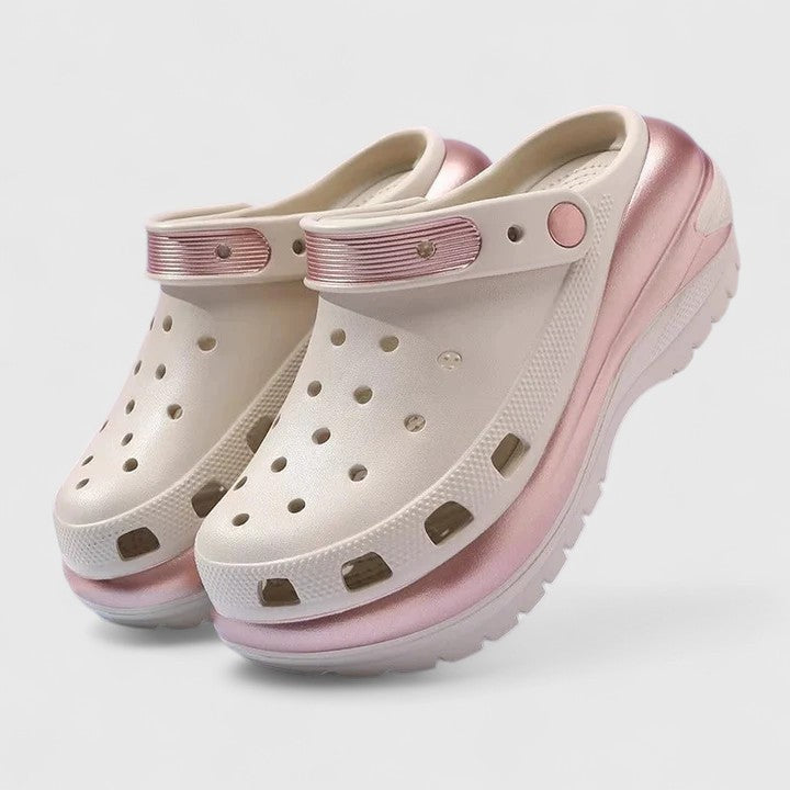 Beige platform clogs with rose gold accents and ventilated design