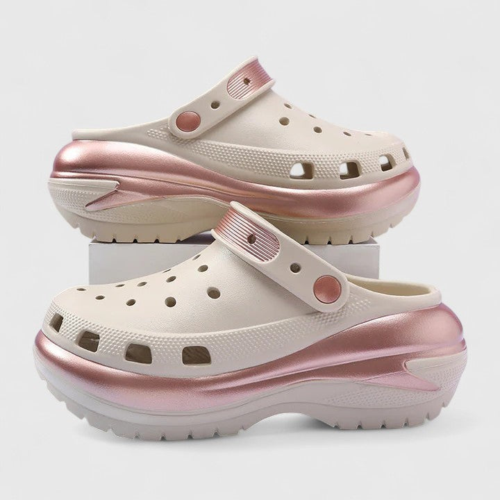 Cream platform clogs with rose gold metallic accents and perforated top