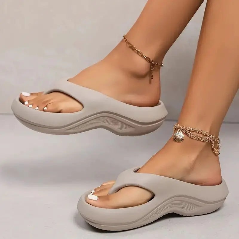 beige thick-sole flip flops with cushioned platform sole and thong strap