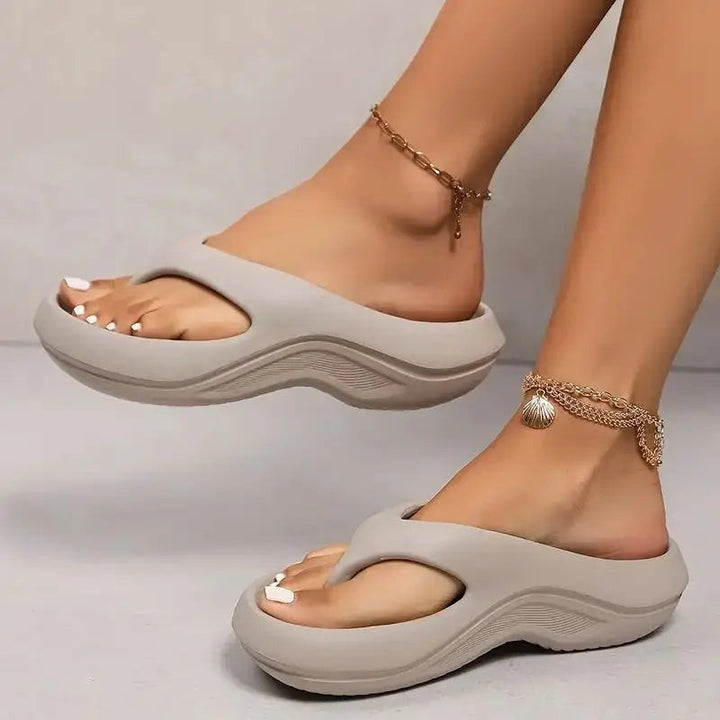 beige thick-sole flip flops with cushioned platform sole and thong strap