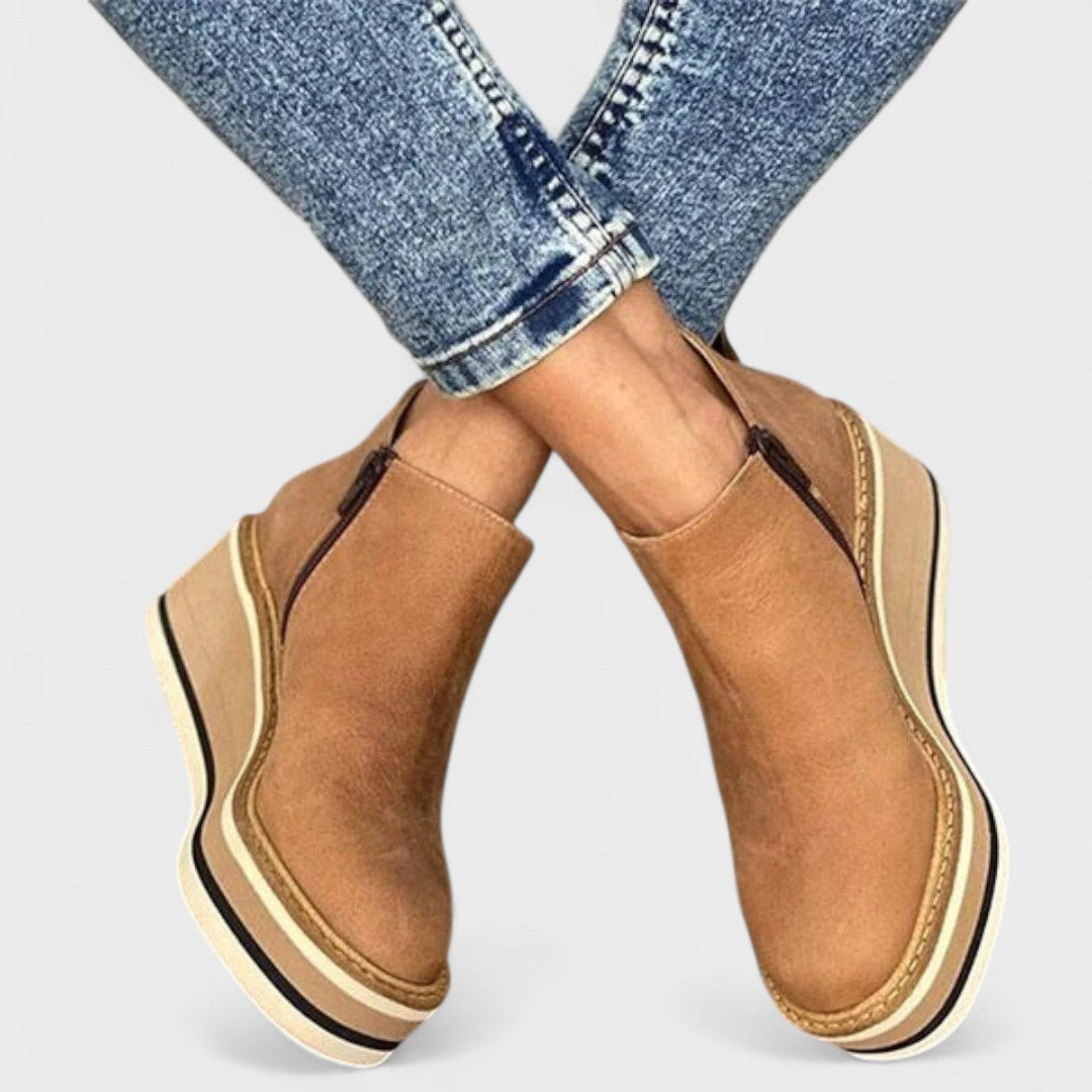 navy blue leather ankle boots with wedge heel side profile