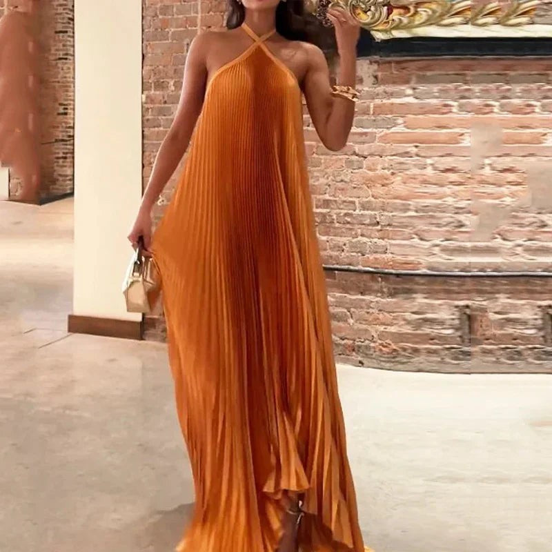 Halter neck pleated maxi dress in burnt orange satin with gold clutch