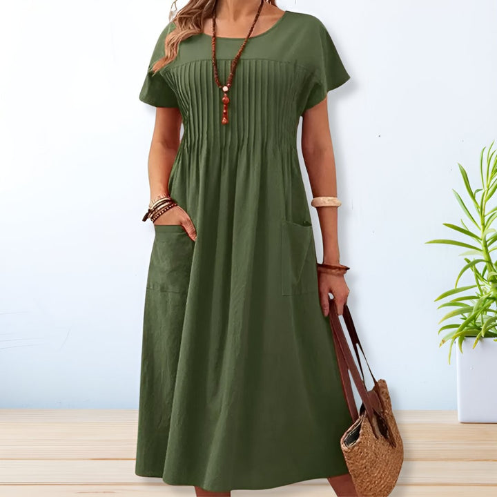 Olive green pintuck midi dress with short sleeves and side pockets
