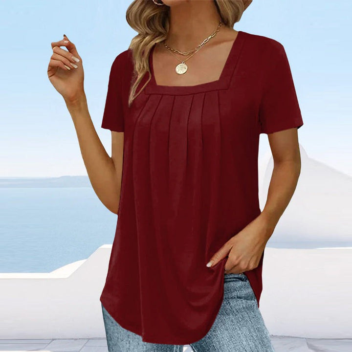 Burgundy pleated blouse with square neckline and short sleeves