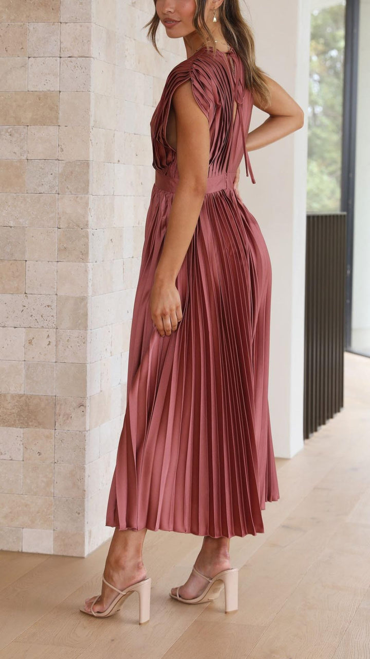 Back view of rust pink pleated satin dress with open back detail