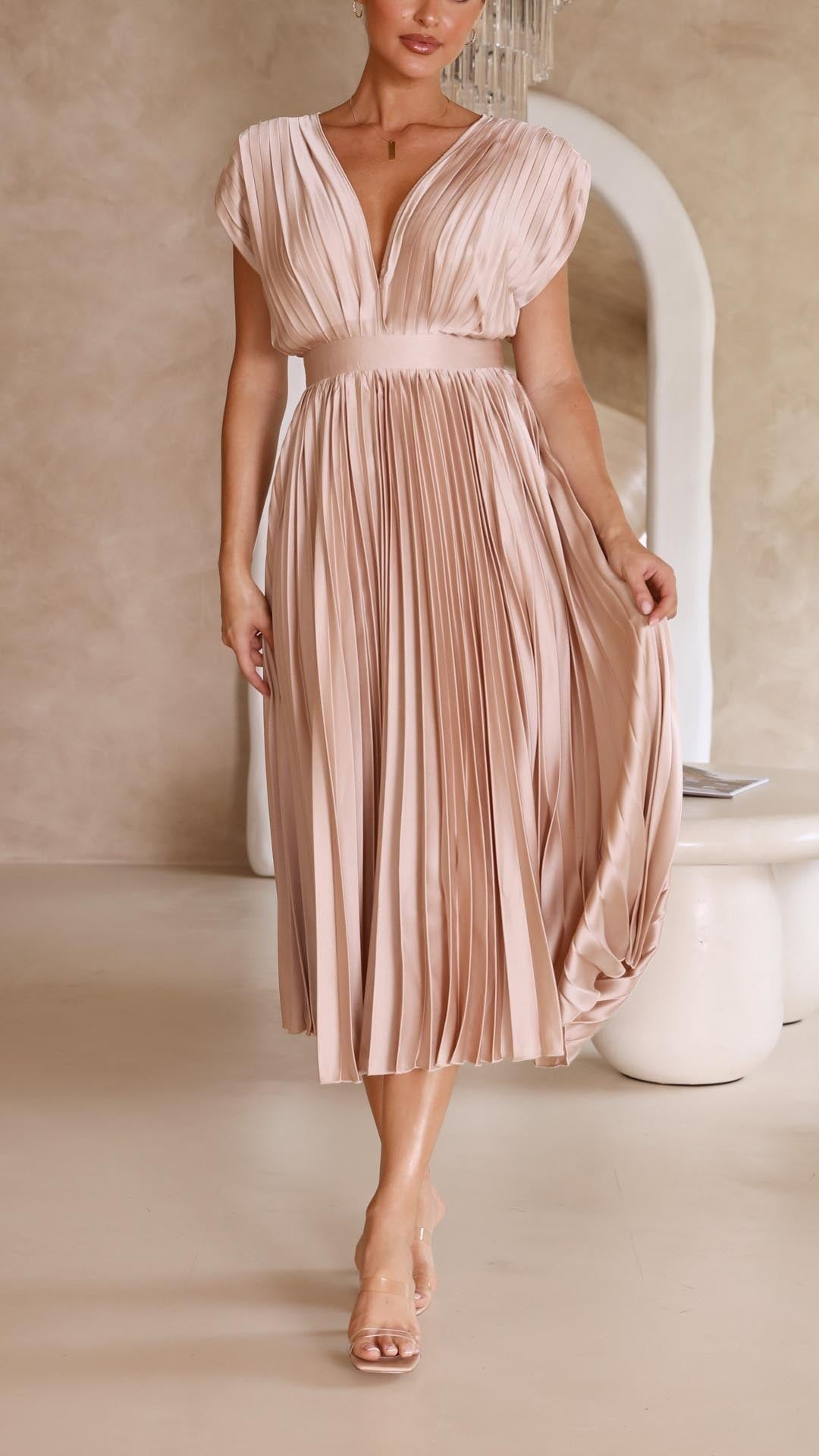 Blush pink pleated satin midi dress with deep V-neck and fitted waist