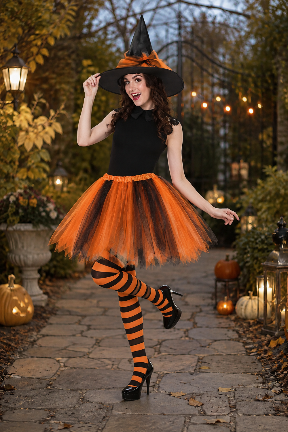 witch costume in orange and black with pointed hat and striped stockings