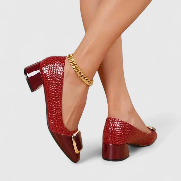 Burgundy croc-print block heel pumps featuring a gold buckle accent