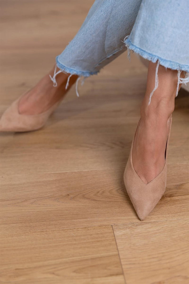 Tan suede pointed toe heels showcasing V-cut vamp detail