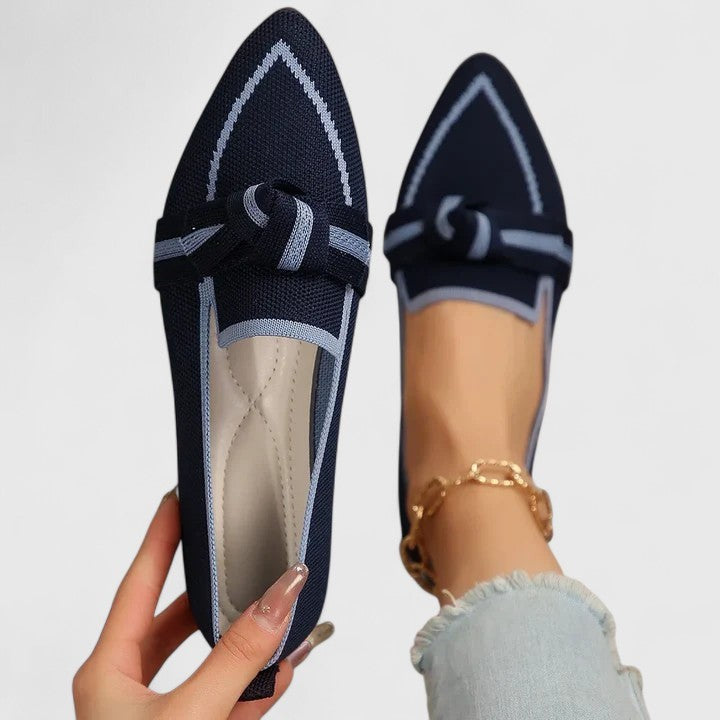 Navy blue knit flats with light blue trim and bow accent