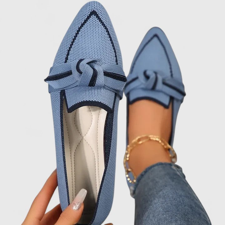 Light blue knit pointed-toe flats with navy trim and knot detail